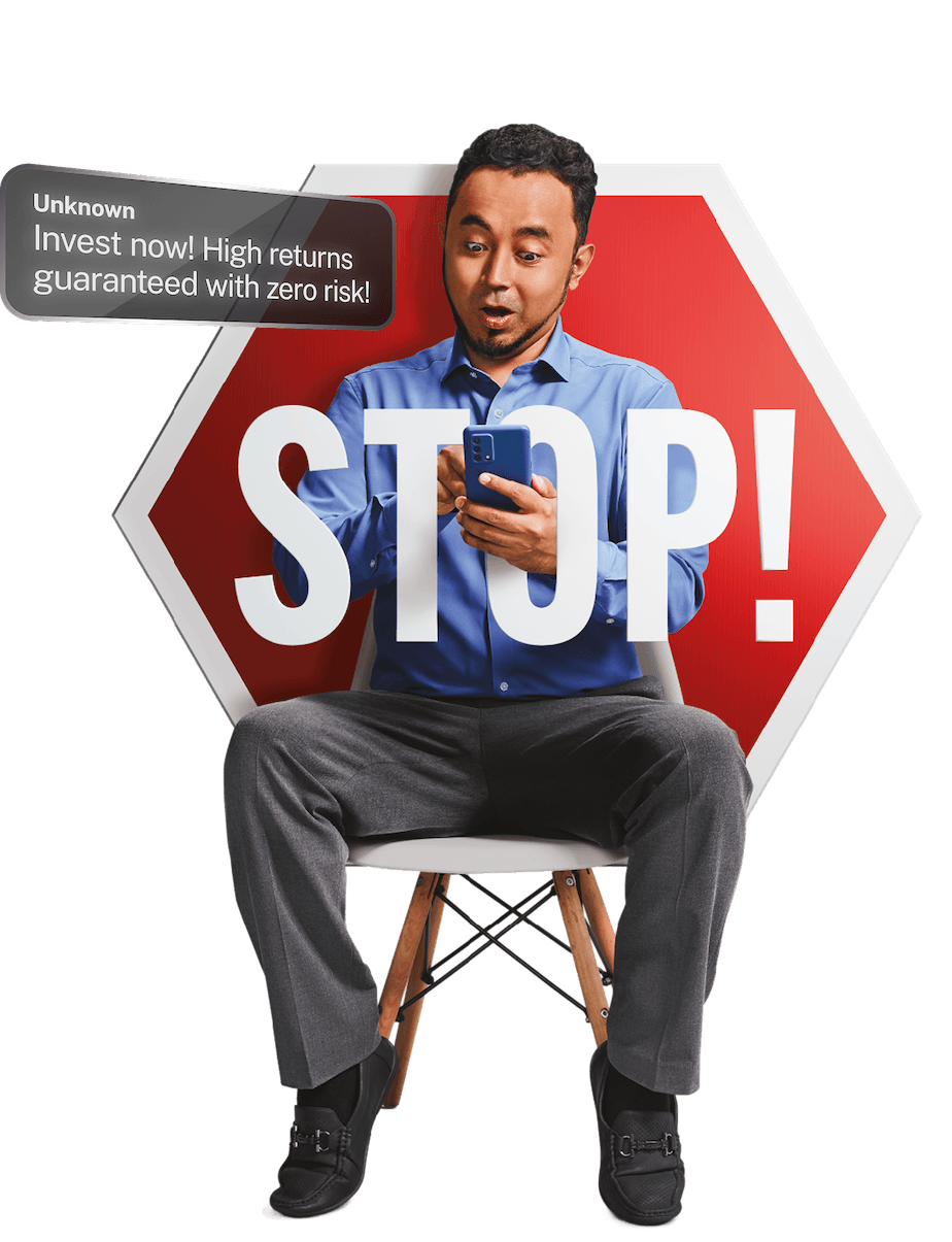 Investment scam awareness - man with phone and stop sign warning